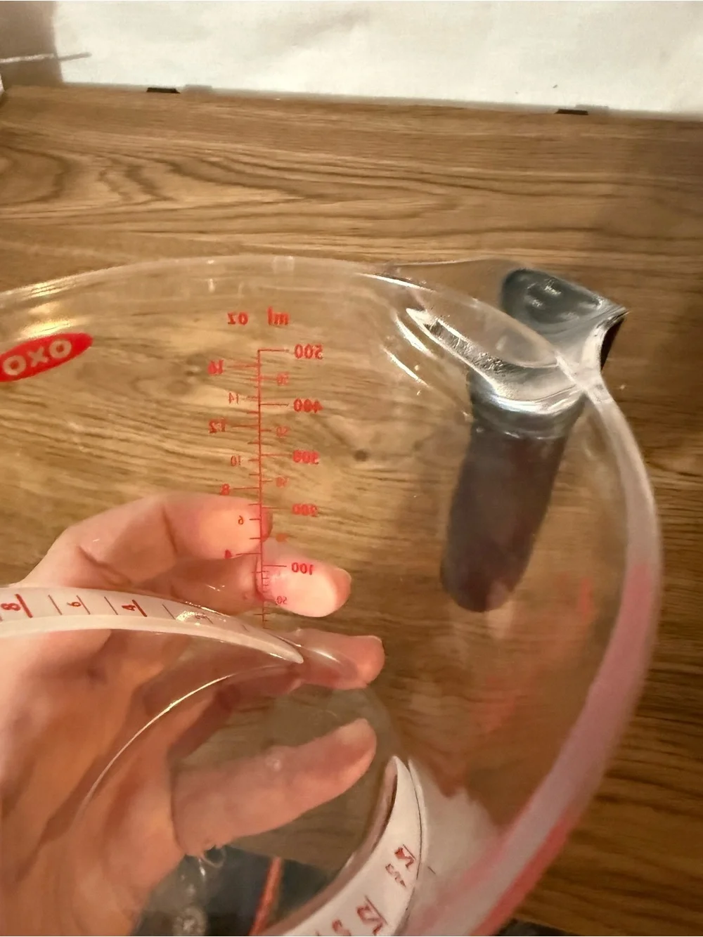 Oxo Clear Plastic Measuring Cup with Black Handle and Red Markings